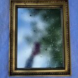 Old mirror in gilded wood