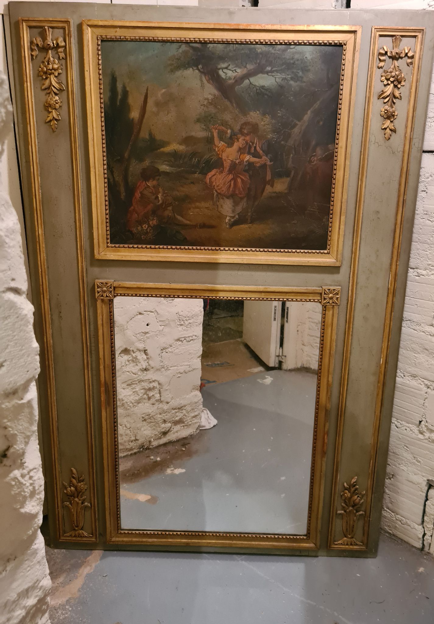 Lacquered wooden trumeau in the Louis XVI style, late 19th century.