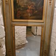 Lacquered wooden trumeau in the Louis XVI style, late 19th century.