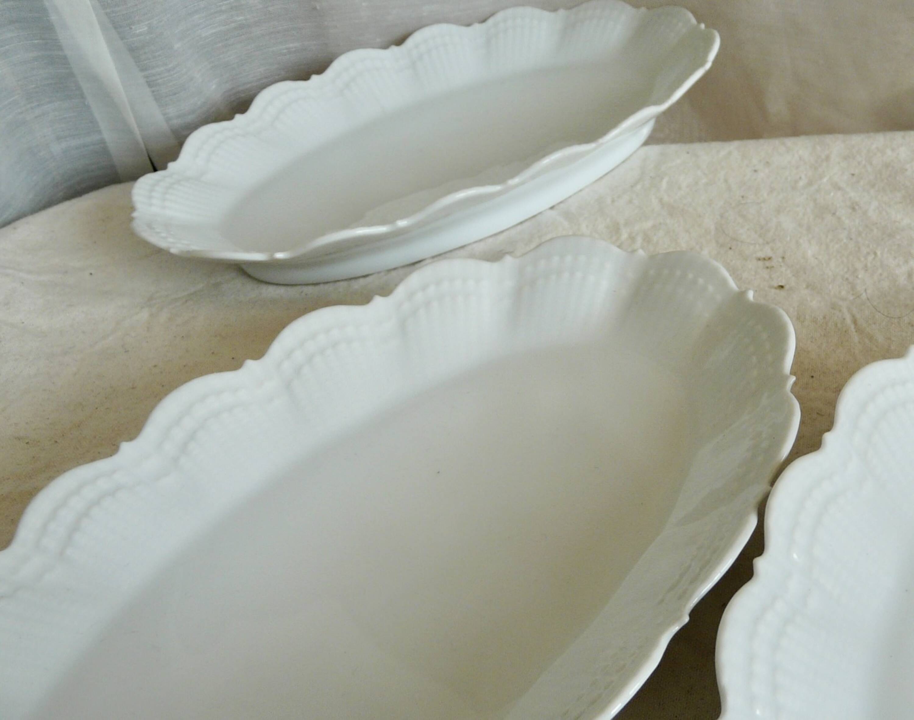 Service of 4 white porcelain dishes from Limoges Art Deco