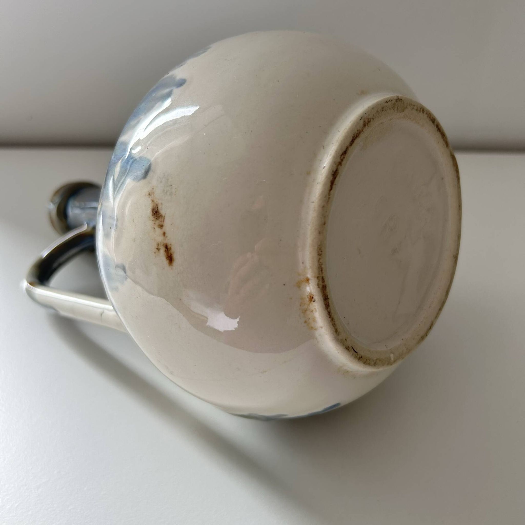 Cherry-decorated earthenware carafe