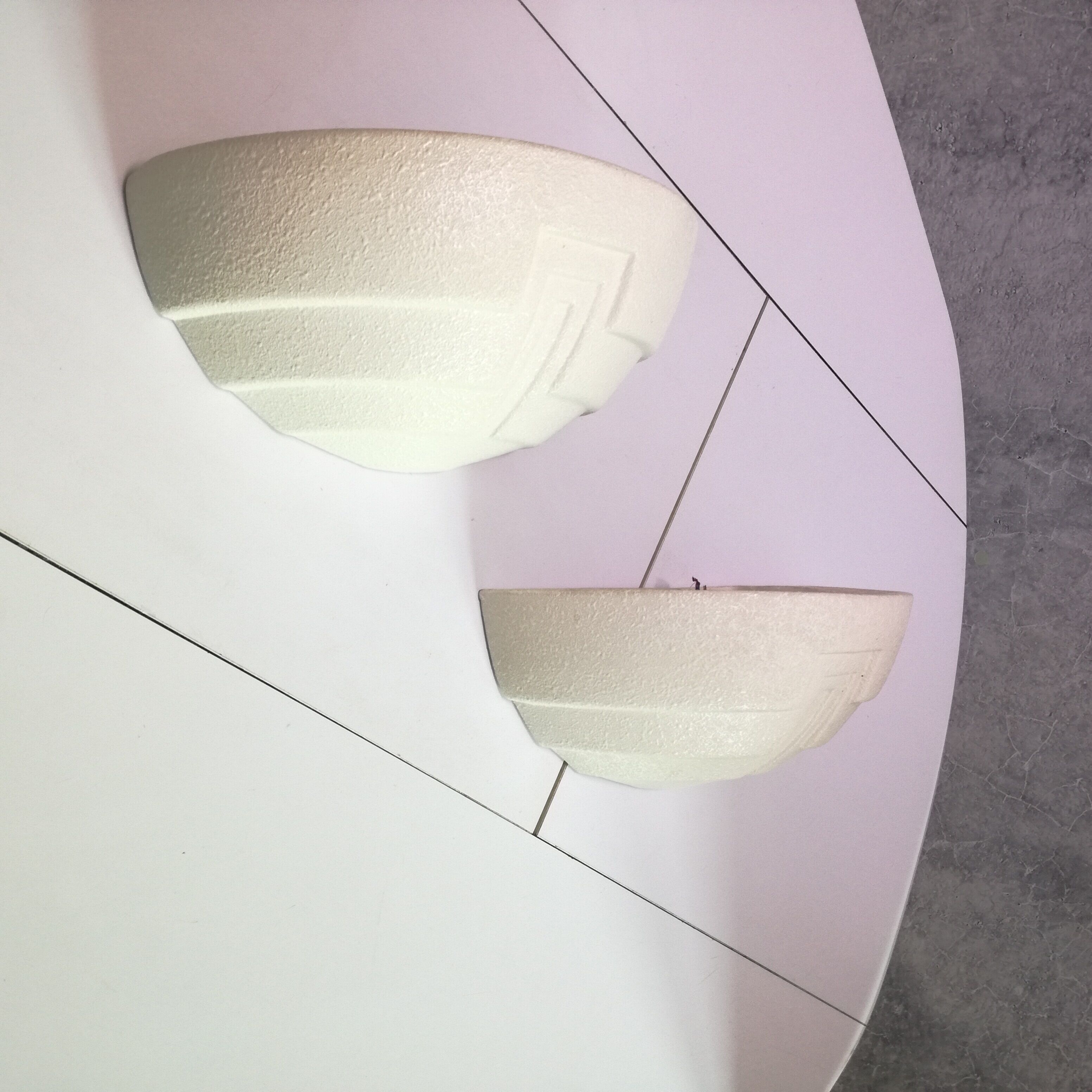 Wall sconces in stone and in the shape of a basin