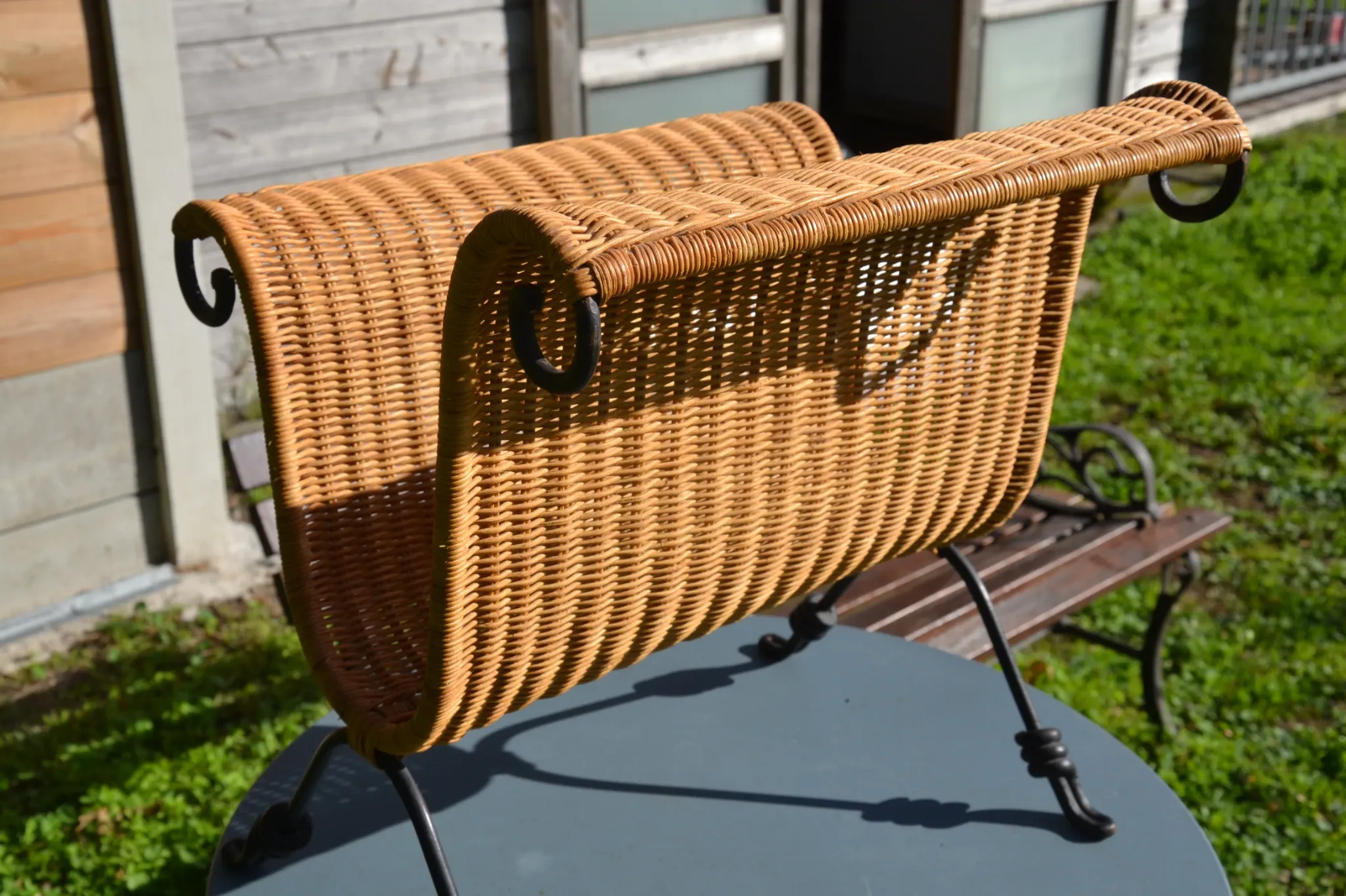 Wrought iron and rattan magazine/newspaper rack