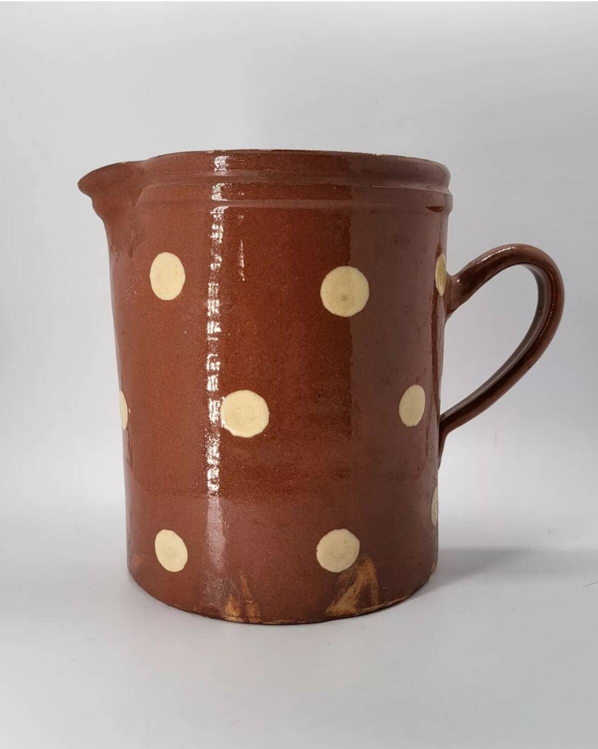 Old pitcher with polka dots savoyard pottery in glazed terracotta alsace