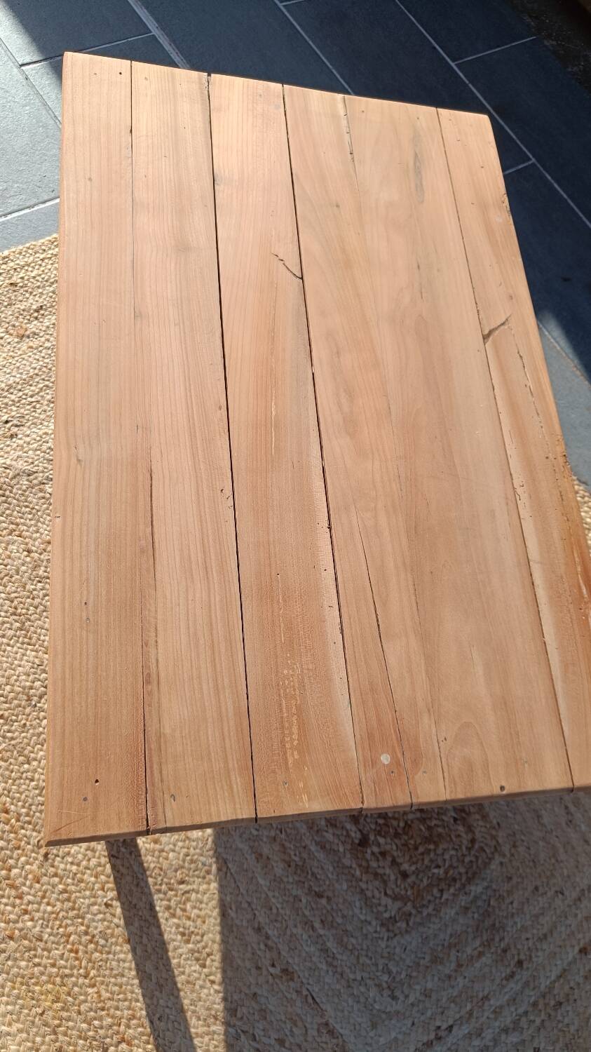 Low farmhouse table in raw wood