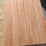 Low farmhouse table in raw wood