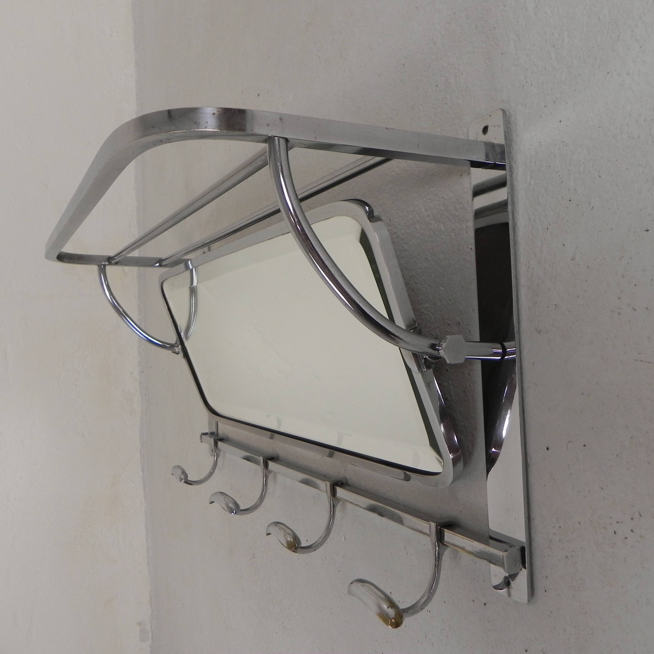 Art Deco wall coat rack with a bevelled mirror adjustable in a chrome frame, 1930s.