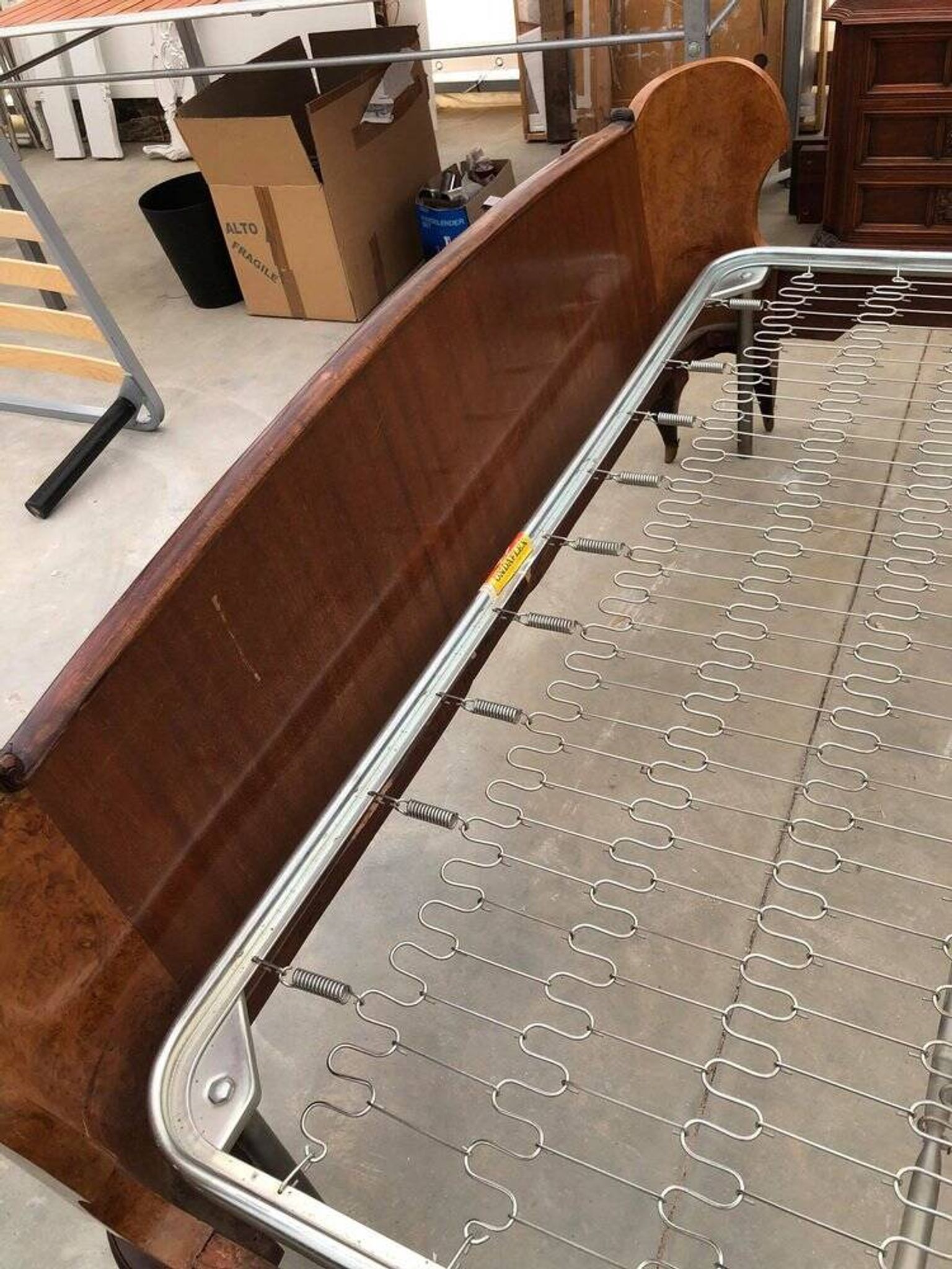 Brown lacquered wooden double bed frame in Mid-Century style from the 1940s.