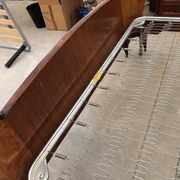 Brown lacquered wooden double bed frame in Mid-Century style from the 1940s.