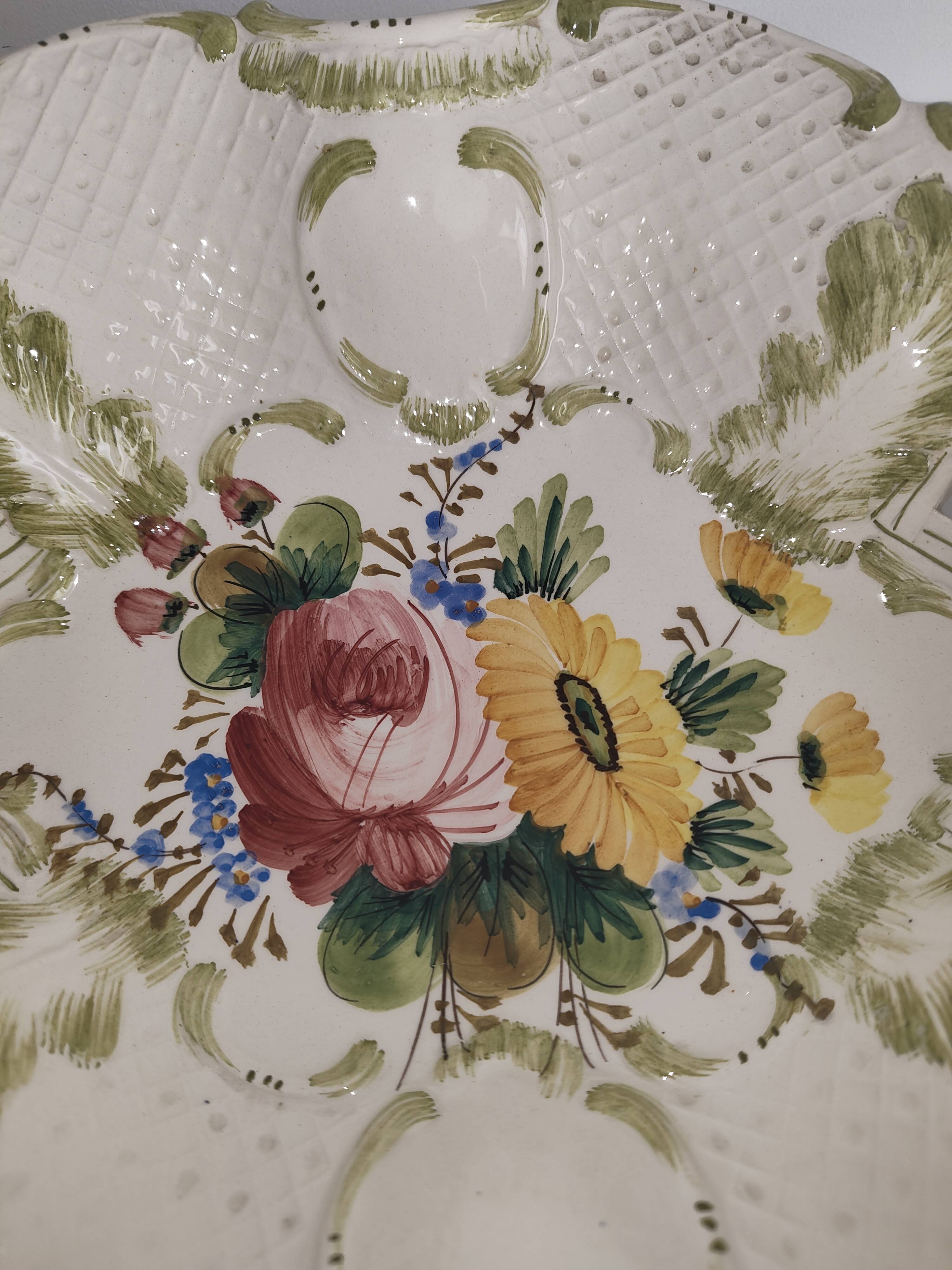 Openwork ceramic bowl with raised flower decoration in Italian style.
