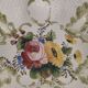 Openwork ceramic bowl with raised flower decoration in Italian style.