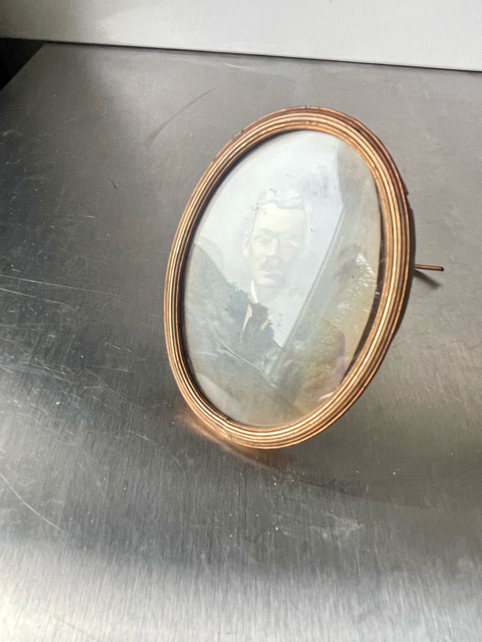 Metal gold colored oval picture frame brass
