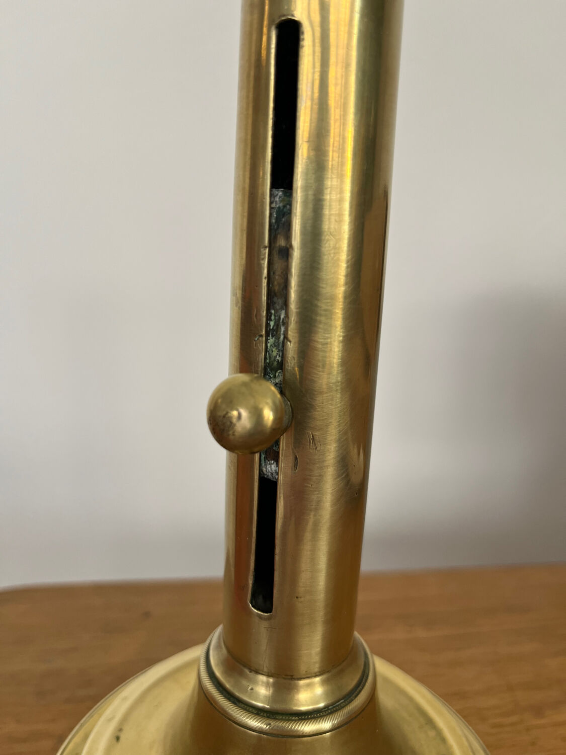 Antique brass push candle holder