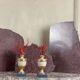 Pair of red corals on gilded and blue wooden bases