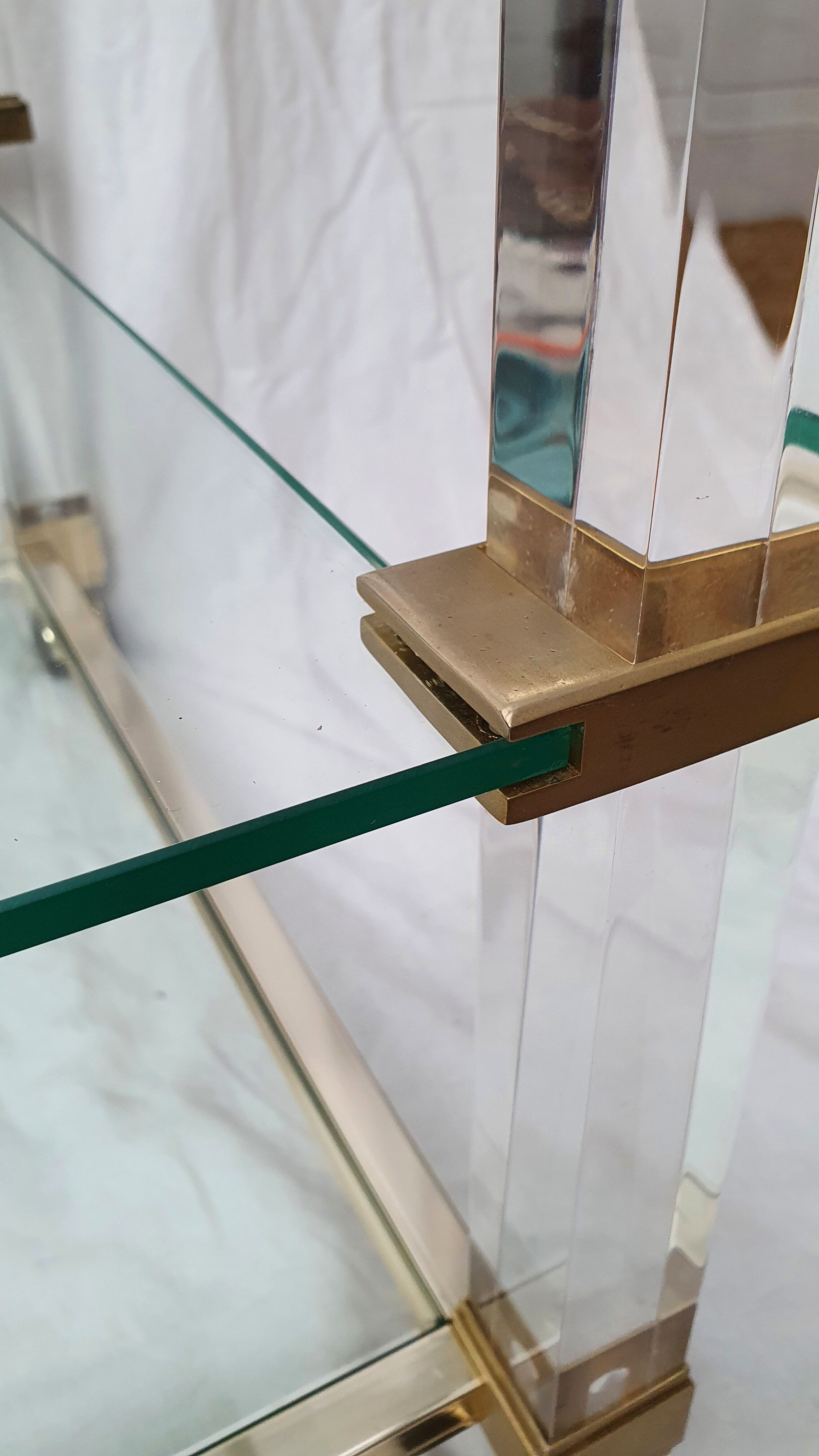 Rolling glass and plexiglass shelf by Pierre Vandel