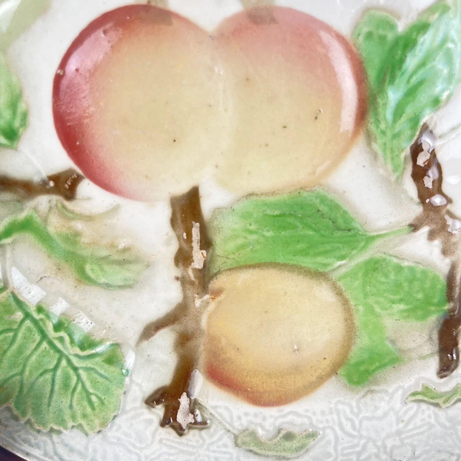 Set of 4 plates KG St Clément barbotine fruit (cherry, mirabelle, grape, pear), late 19th-early 20th century.