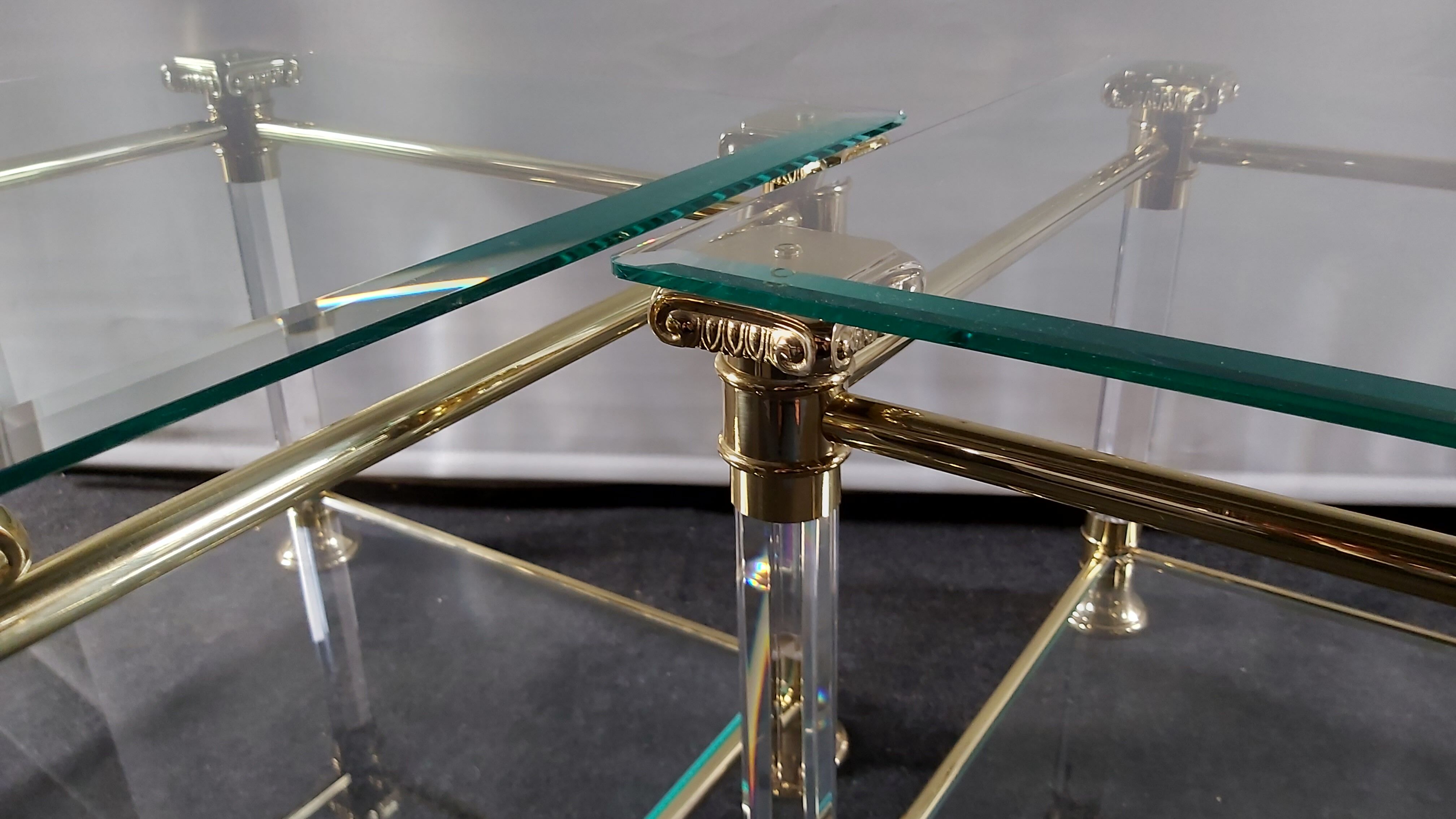 Pair of tables in brass, acrylic and glass