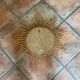 Mirror sun in braided rattan.