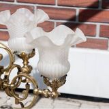 Grand lustre en laiton, Europe occidentale, milieu du XXe siècle.