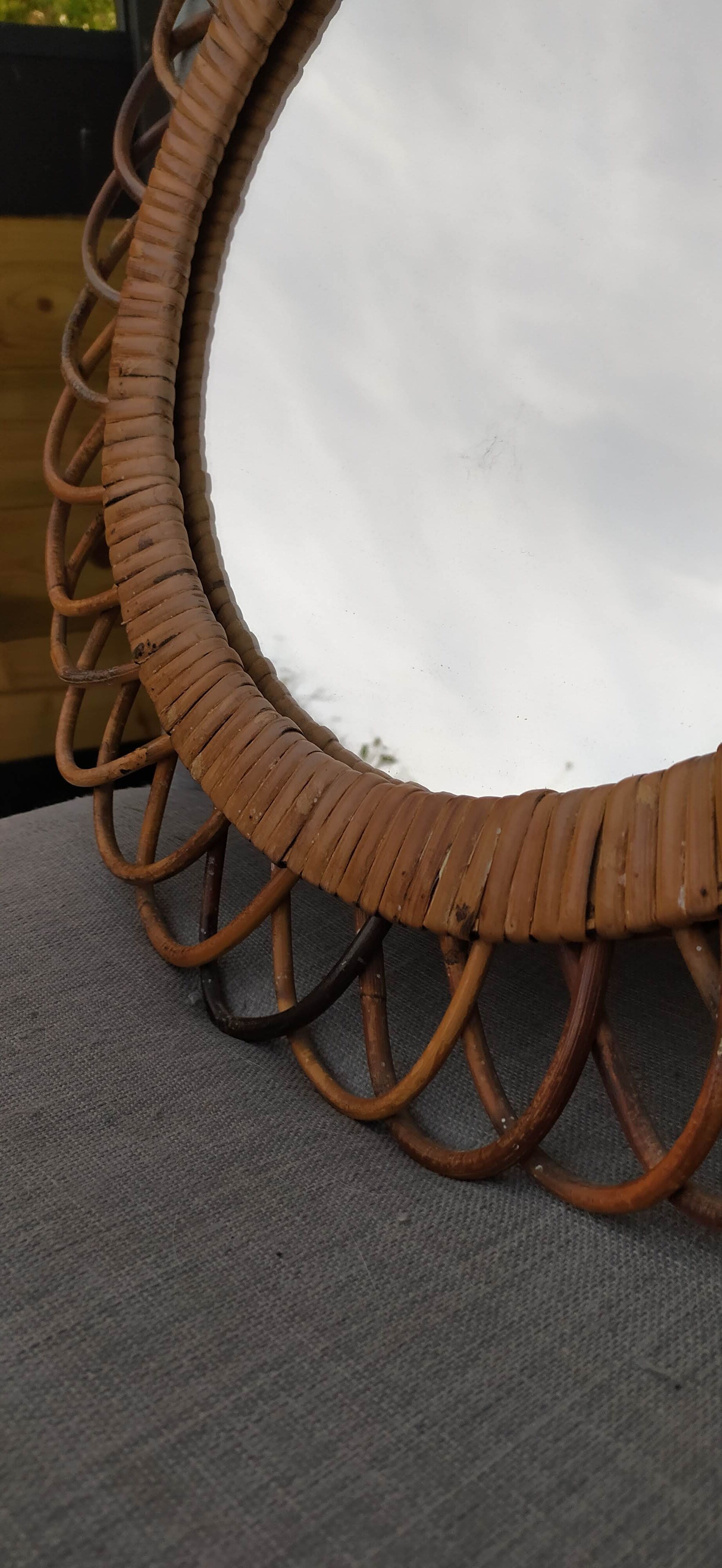 Vintage mirror in rattan flowers, sun