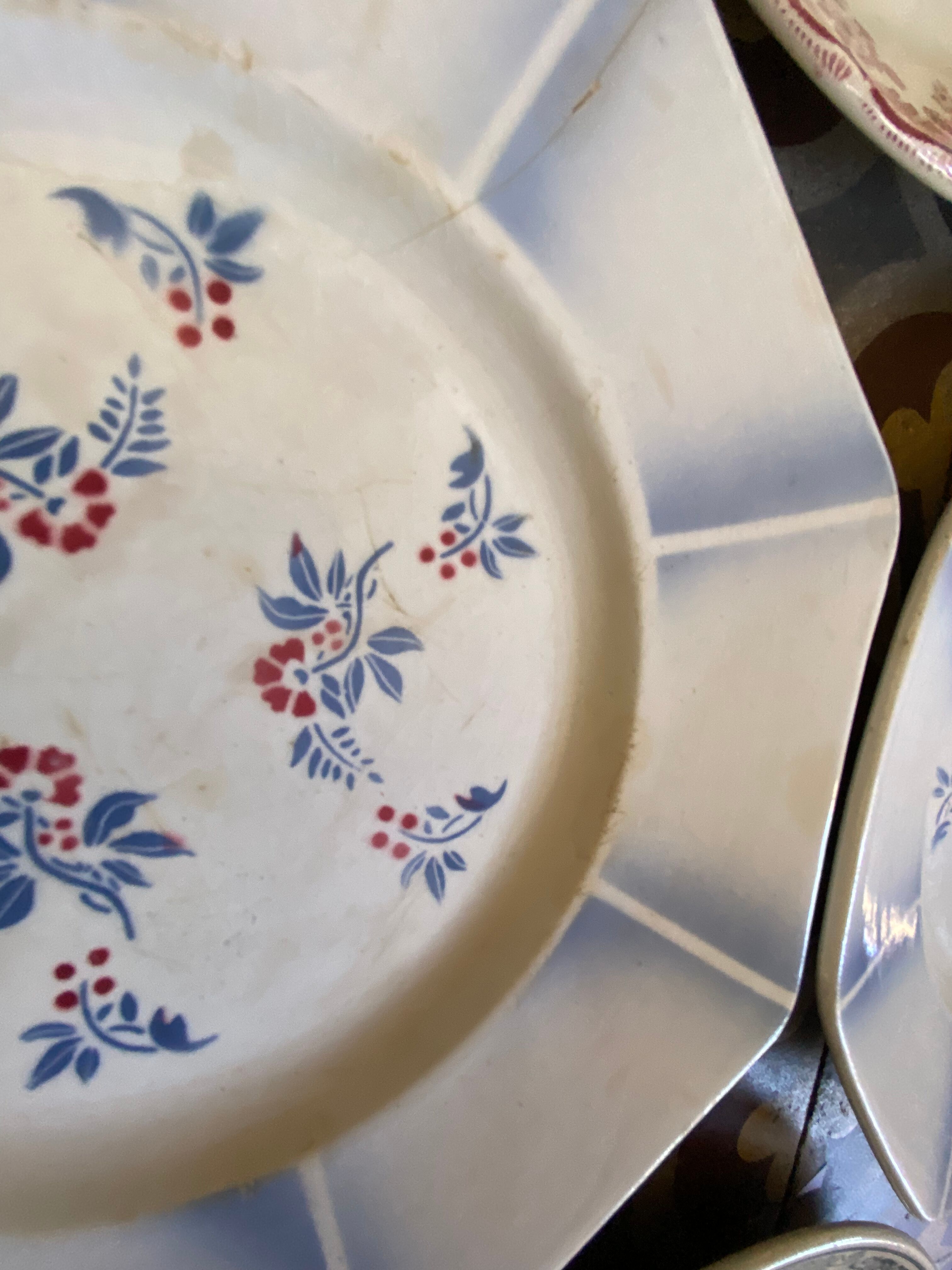 7 matching dessert plates in red green and blue.