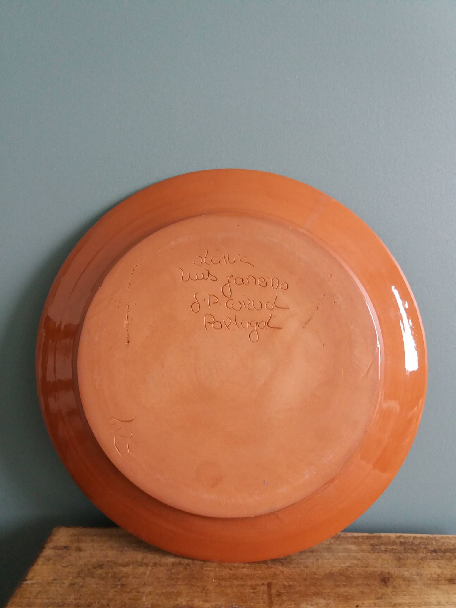 Plate signed Luis Janeiro, Portugal, enamelled terracotta plate