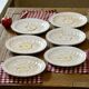 Vintage earthenware plates with a trompe l'oeil apple tart design
