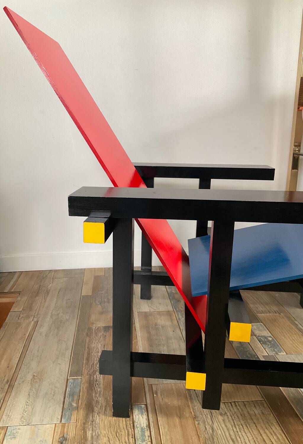 “Red and blue” lounge chair in the style of Gerrit Rietveld