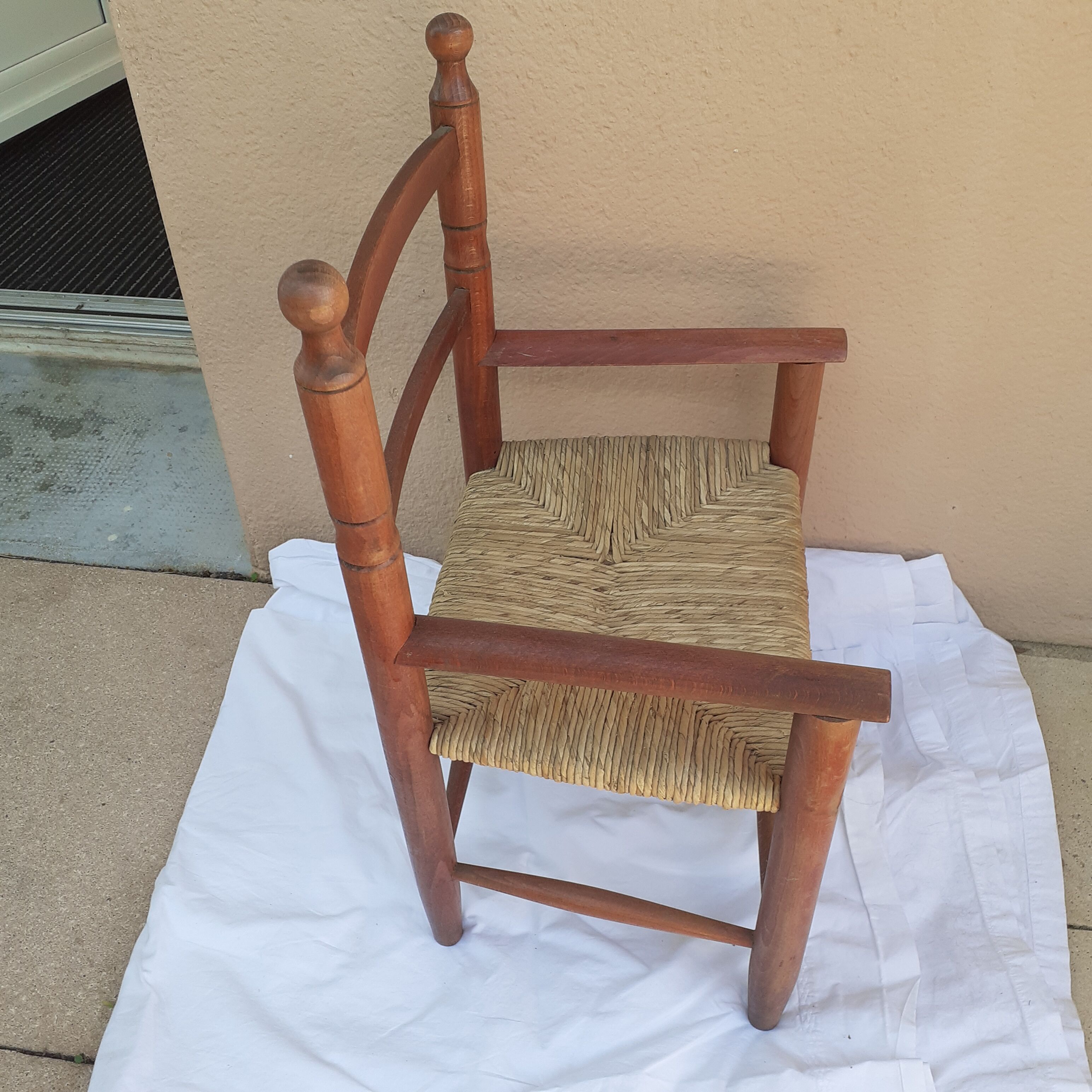 Children's armchair in dark wood and straw