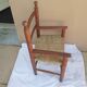 Children's armchair in dark wood and straw