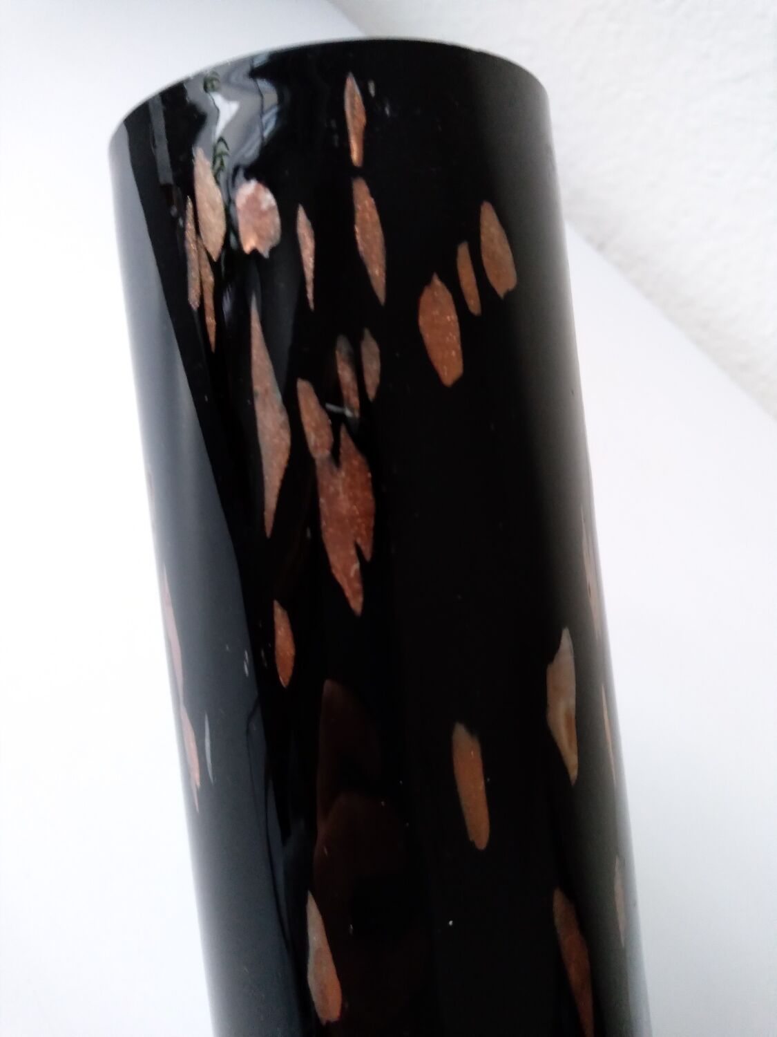 Black opaque glass vase with minimalist style copper inlays