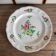 Large round dish KG Lunéville Reverbère, earthenware from the East, floral decoration.