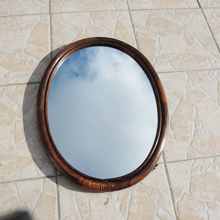 Vintage oval rattan mirror