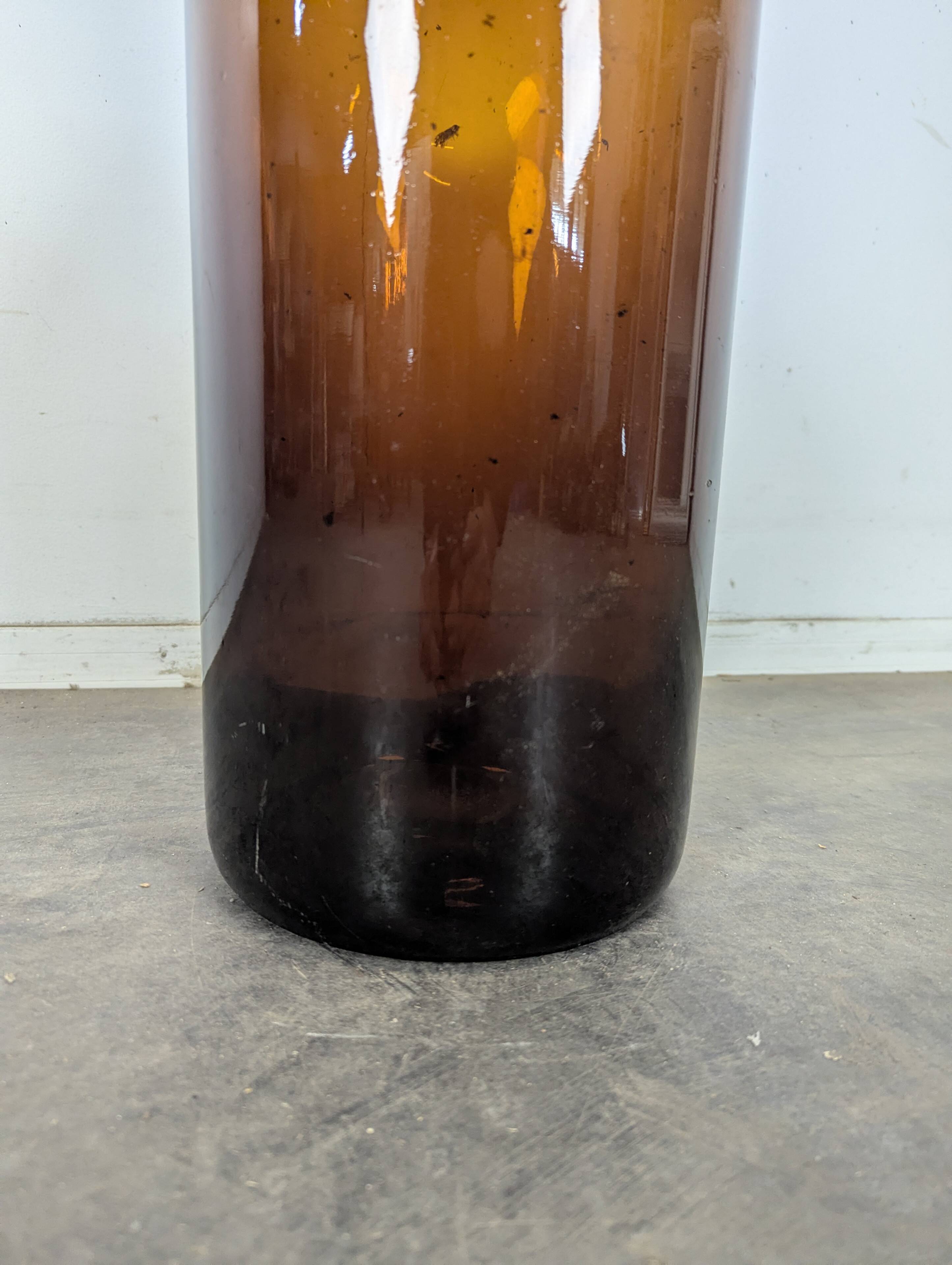 Large antique blown amber glass bottle