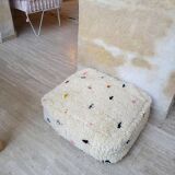 White square pouf cover with colorful polka dots