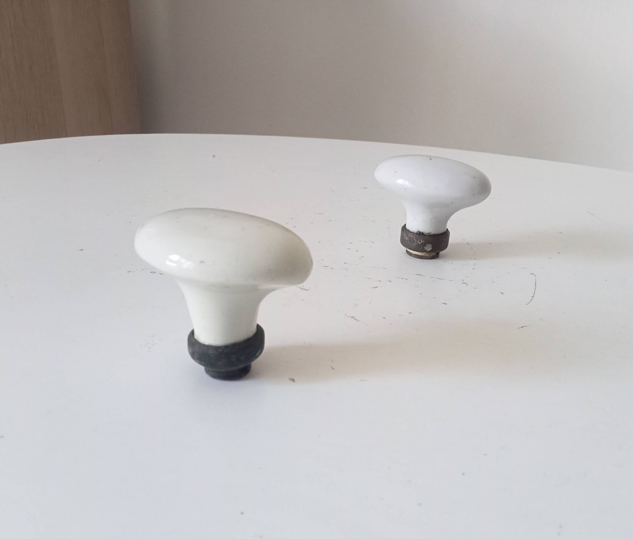 Pair of antique oval door handles in porcelain and brass.
