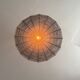 Large lampshade made of woven ropes.