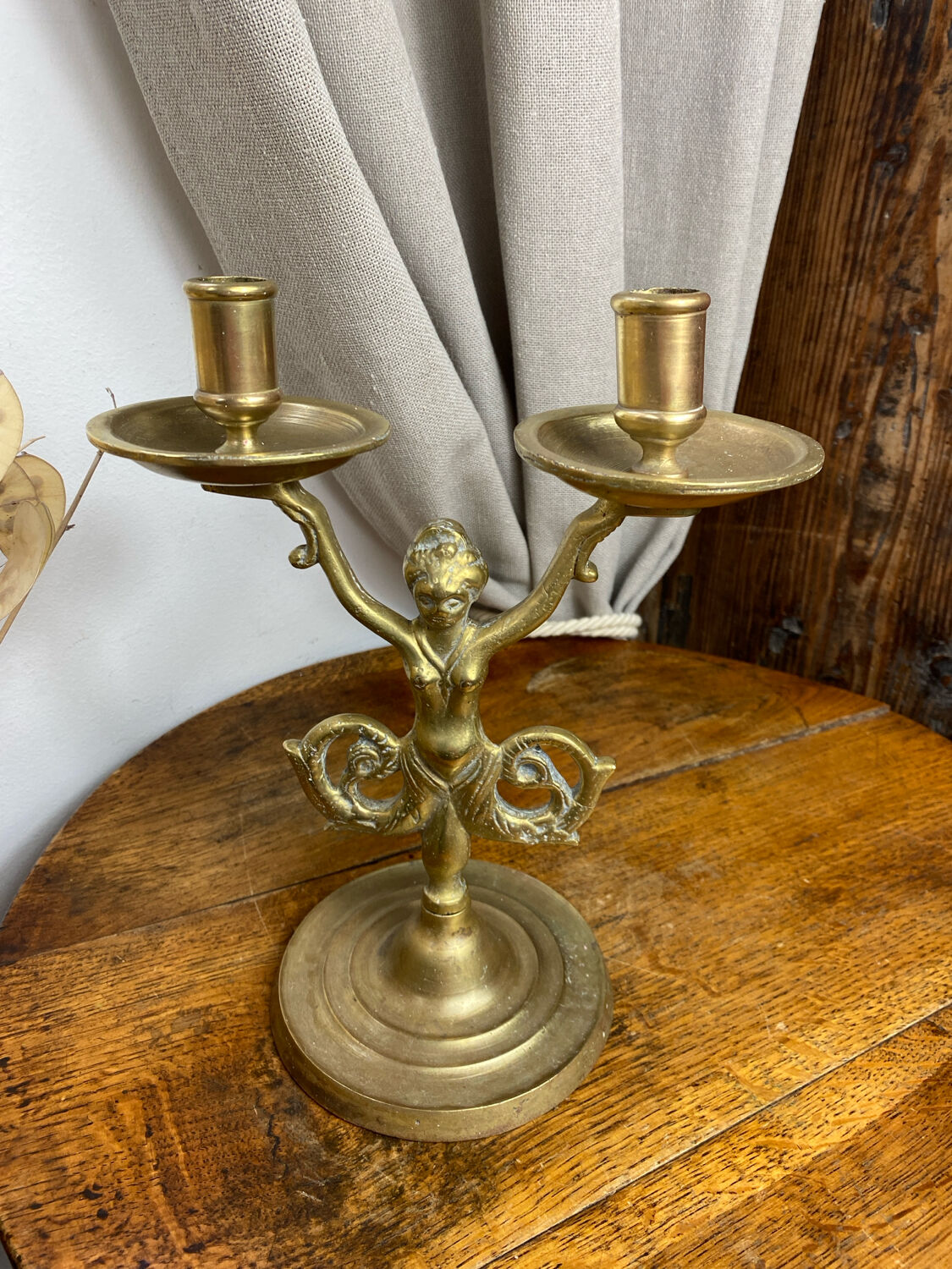 Mermaid-shaped chandelier in bronze