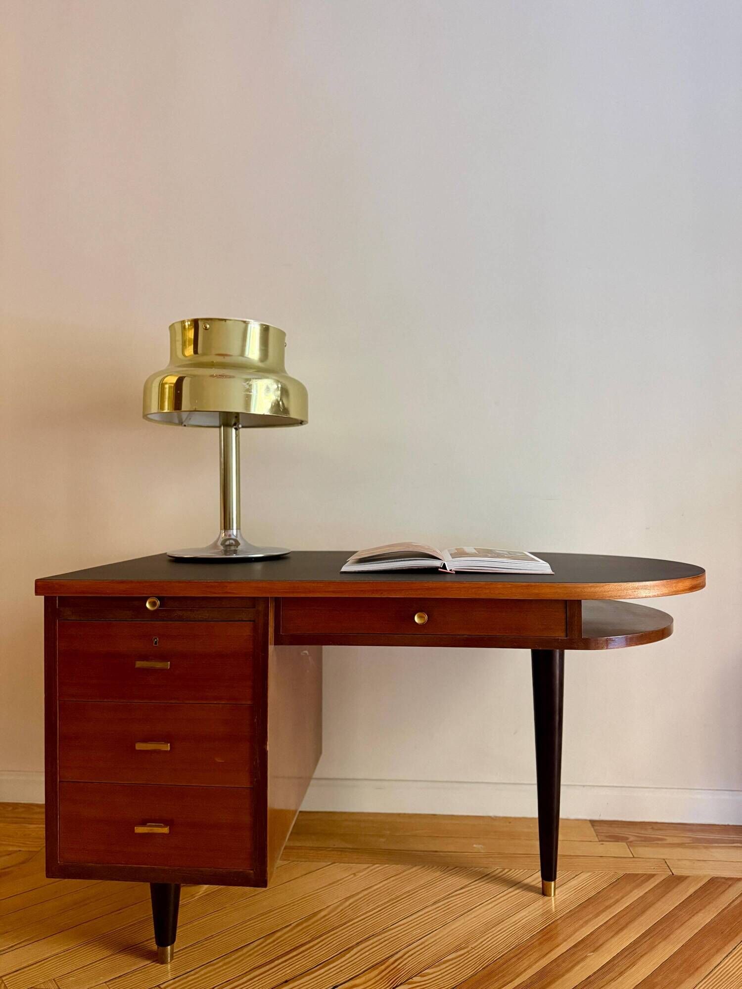 French desk "Prouve" in walnut, bronze and rubber from the 1970s.