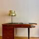 French desk "Prouve" in walnut, bronze and rubber from the 1970s.