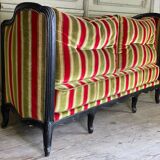 Louis XV style sofa in carved wood with a black patina