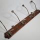 Antique wall-mounted coat rack in wood and metal with 4 hooks, 66 cm