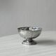 Set of 6 silver stainless steel ice cream bowls on a stand.