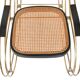 Modernist rocking chair in gilded brass and cane.