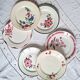 Old mismatched earthenware dinner plates