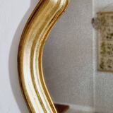 Free form mirror in golden wood