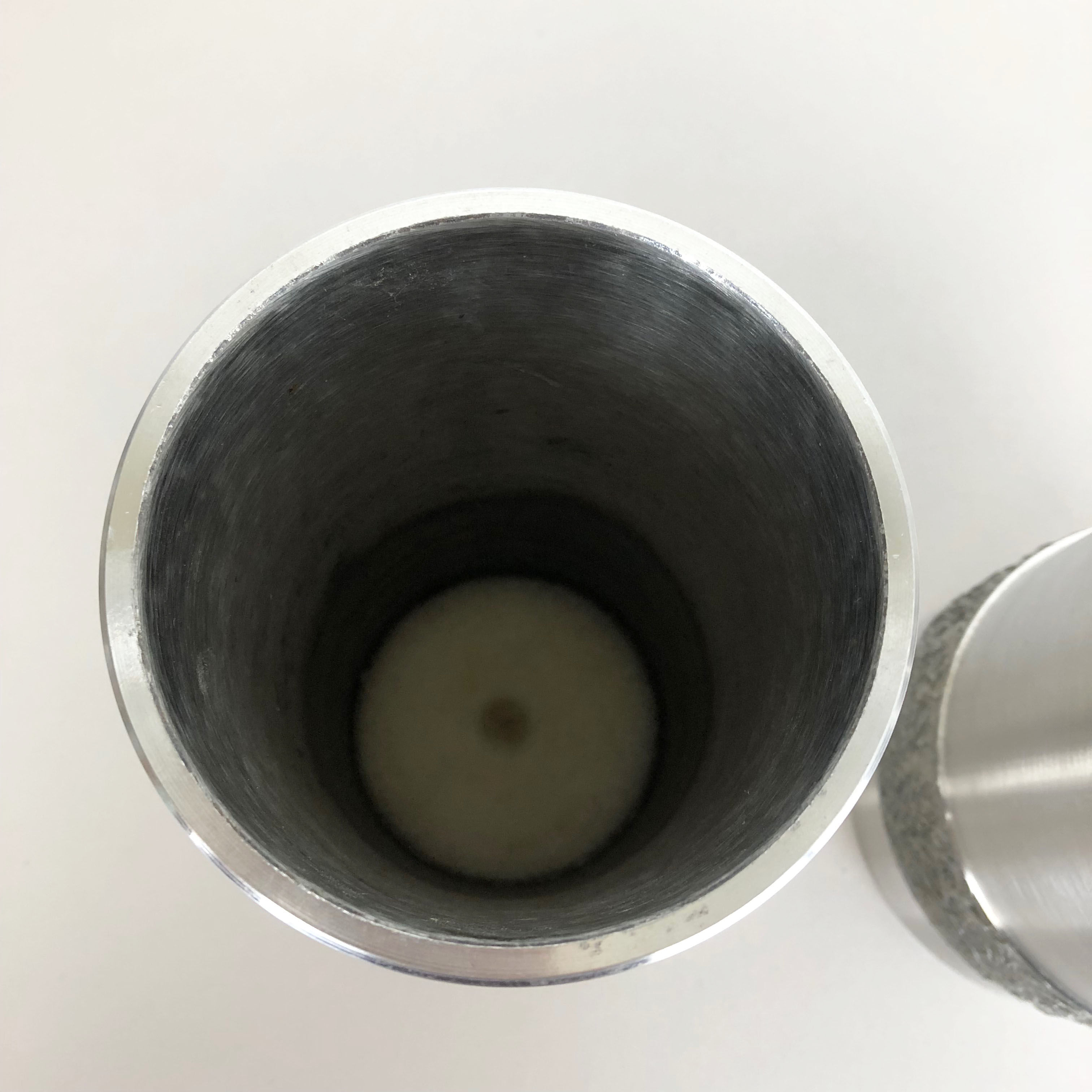 Set of 2 modernist vintage sculptural brutalist steel vases, Germany 1970s