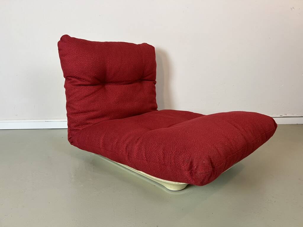 Vintage red shell lounge chairs from the 70s mid-century retro.