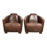Set of 2 cowhide Aviator design armchairs in a warm brown colour