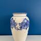 Vintage white and blue ceramic vase with floral pattern